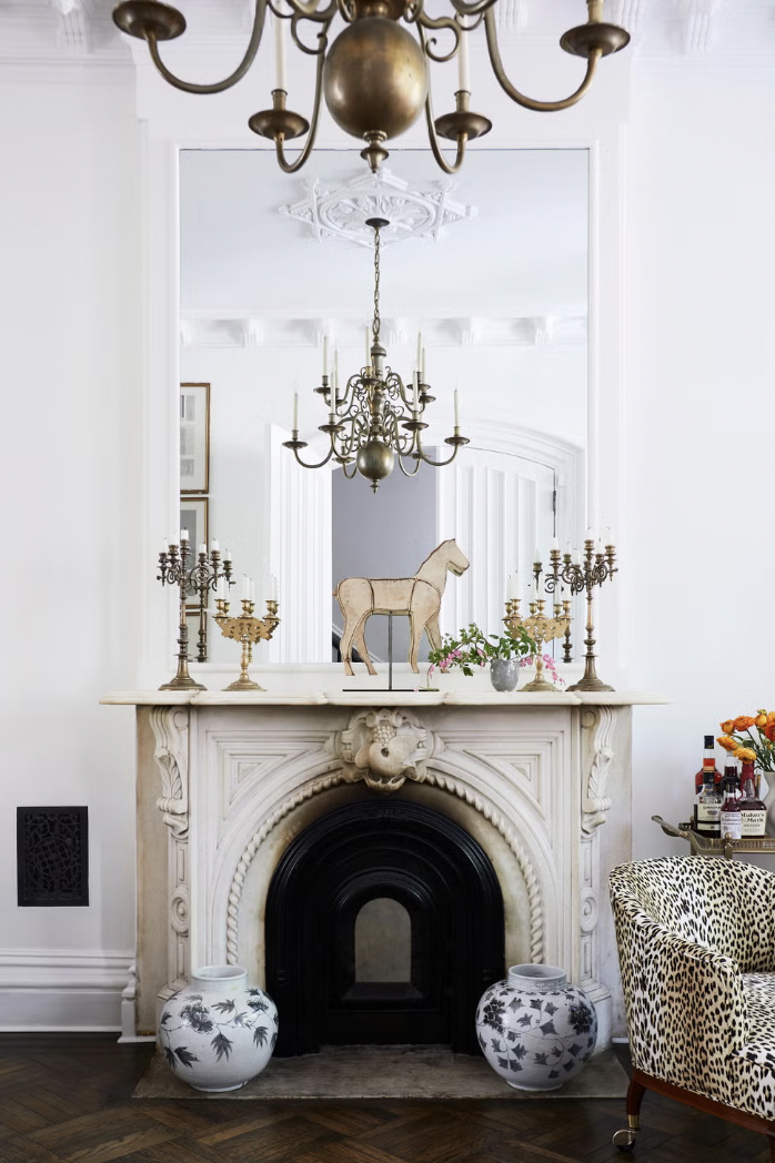 cozy, timeless living area featuring a mix of classic furniture pieces, built-ins, and warm neutral tones with collected décor.